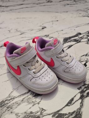 Nike Kids White Sneakers with Pink Swoosh and Purple Lining